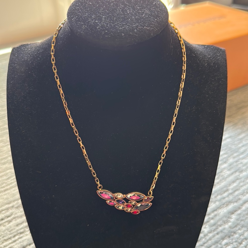 Authentic Swarovski necklace gold with purple garnet stones.